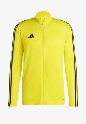 Giacca gialla con zip realizzata in tessuto liscio, con righe nere lungo le maniche e il logo adidas sul petto.