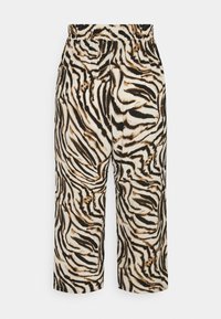 Pantalons à taille élastique avec un motif rayé tigre noir et marron sur un tissu beige clair, avec des jambes droites et raccourcies.