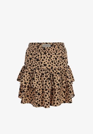 Beige gelaagde minirok met zwarte hartvormige vlekken en een elastische tailleband, met een label waarop "Looxs Revolution" staat.