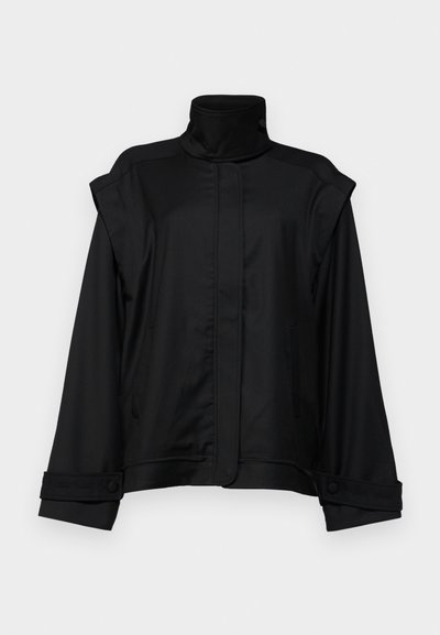 Black jacket with a high collar, wide sleeves, and two side pockets; made of smooth fabric, featuring buttoned cuffs and a minimalist design.
