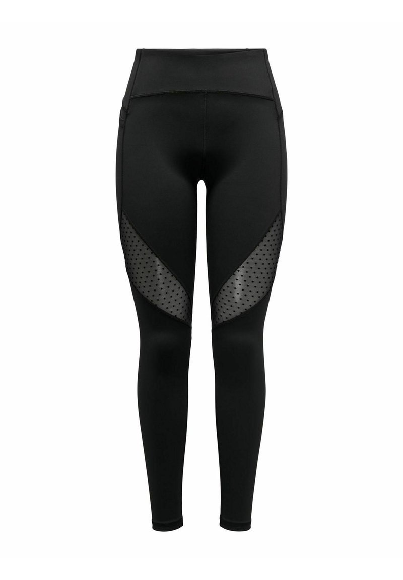 Black leggings with a high waistband, featuring contrasting sheer mesh panels with polka dots on the sides. Smooth, elastic fabric.
