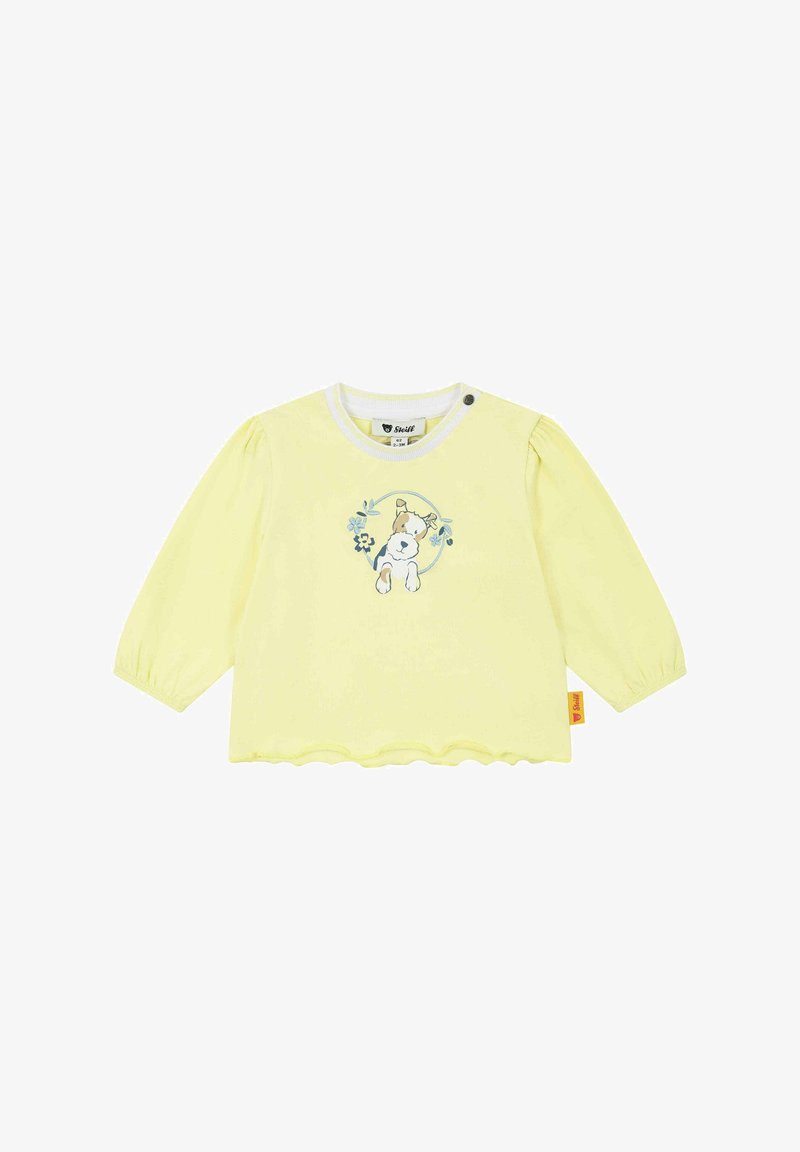 Gelbes Langarmshirt aus weichem Stoff, mit einem Hasen- und Blumendesign auf der Vorderseite, gewelltem Saum und einer Knopfverschluss.