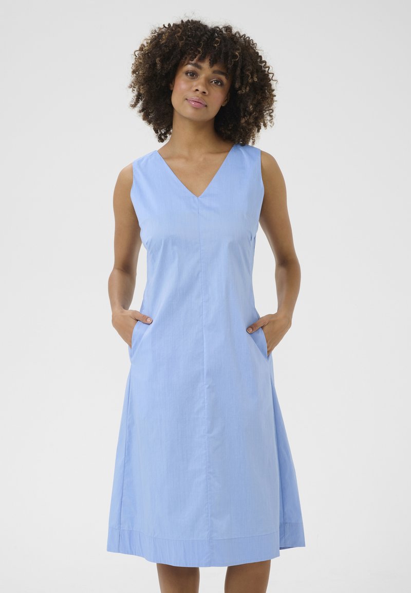 Light blue sleeveless dress with a V-neckline, side pockets, and a knee-length A-line silhouette. Smooth fabric with a subtle texture.