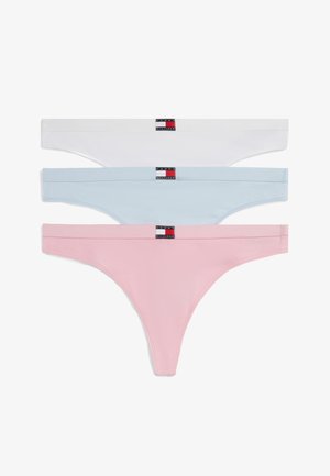 Drie Tommy Hilfiger damesstringonderbroeken in wit, lichtblauw en roze met logotags op de tailleband.