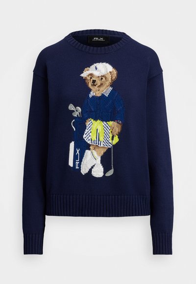 Navy knitted sweater featuring an embroidered bear in golf attire, holding a club and golf bag. Ribbed cuffs and hem, relaxed fit.