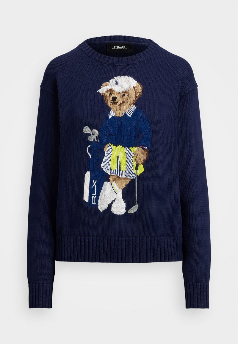 Mørkeblåt strikket sweater med en broderet bjørn iført golfudstyr, der holder en golfkølle og en golfbag. Ribbet manchet og nederste kant, afslappet pasform.