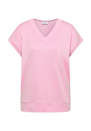 Haut pour femme rose clair à manches courtes avec col en V, manches retroussées et ourlet droit, fabriqué en tissu doux avec une étiquette CECIL à l'intérieur de l'encolure.