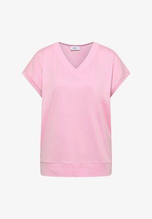 Vaaleanpunainen, lyhythihainen V-pääntiellä varustettu naisten paita, jossa on käännetyt hihansuut ja suora helma, valmistettu pehmeästä kankaasta ja jossa on CECIL-merkki kaula-aukon sisäpuolella.