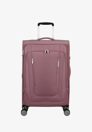 Valigia morbida viola con ruote, manico telescopico, tasche anteriori con cerniera e lucchetto, in piedi su sfondo bianco.