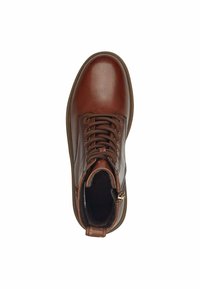 Bottine en cuir marron avec une finition lisse, bout rond, lacets sur le devant et détail de fermeture éclair sur le côté. Doublure douce visible à l'intérieur.