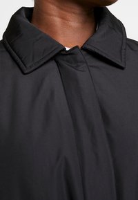 Calvin Klein Jeans Pitkä takki - black