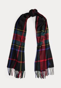 Black and multi-colored plaid scarf, made of soft material, featuring fringed edges and a monogram accent on one end.