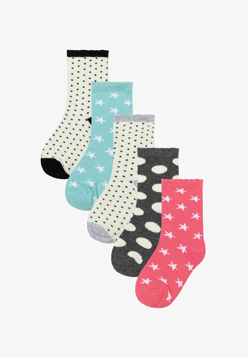 Fünf Paar Socken: weiß mit schwarzen Punkten, mintgrün mit weißen Sternen, grau mit weißen Ovalen und pink mit weißen Sternen. In unterschiedlichen Knöchelhöhen.