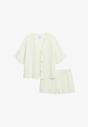 Crèmekleurige, lichtgewicht tweedelige outfit met een top met korte mouwen, V-hals en striksluitingen, gecombineerd met bijpassende shorts met een elastische tailleband.