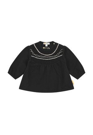 Top nero a maniche lunghe con corpetto arricciato, dettagli ricamati bianchi e chiusura a pressione sul collo. Realizzato in tessuto morbido.