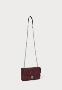 Burgundy leather crossbody bag with a smooth texture, flap closure, embossed RL logo, and a silver chain strap. Compact rectangular shape.