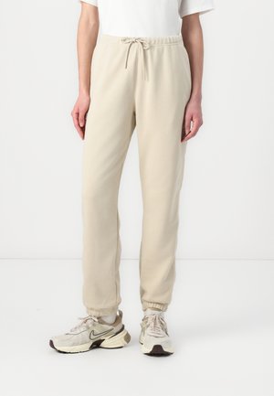 PANT - Verryttelyhousut - rattan/white