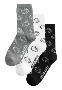Drie paar katoenen sokken: grijs met witte Hello Kitty ontwerpen, wit met zwarte ontwerpen en zwart met witte ontwerpen. Elke heeft "HELLO KITTY" erop gedrukt.