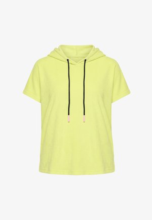 Kortærmet gul hættetrøje med løs pasform og sorte snore med pink ender, forfra på hvid baggrund.