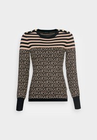 Maglione a righe nere e beige con motivo a ripetizione del logo "GUESS", scollatura rotonda e dettagli con bottoni dorati sulla spalla.