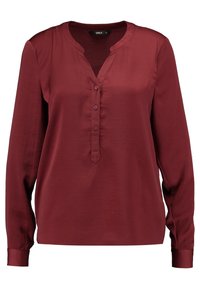 Blusa bordeaux a maniche lunghe con scollatura a V e placket con cinque bottoni. Realizzata in tessuto morbido con una vestibilità comoda e un design minimalista.