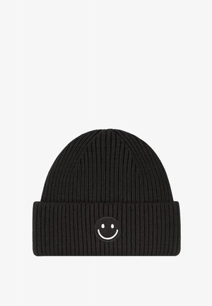 Black ribbed beanie made of textured knit fabric featuring a white embroidered smiley face on the front.