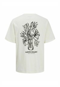 T-shirt crème à manches courtes avec un design floral linéaire noir et le texte "AURORA GALLERY" au centre du dos. Coupe décontractée.