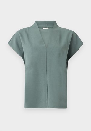 Haut à manches gigot en vert doux, tissu doux avec un décolleté en V et une coupe droite. Design minimaliste sans motifs ni accents visibles.