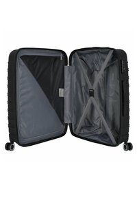 Black hard-shell suitcase with a gray interior, featuring a zippered compartment, mesh pocket, and cross straps for securing items.