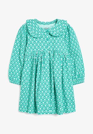 Turkusowa sukienka z długimi rękawami i dużym kołnierzem. Posiada kwiatowy wzór oraz gumowane mankiety. Zapięcie na guziki z przodu.