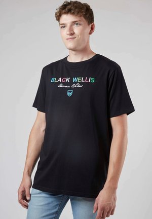T-shirt en coton noir avec texte brodé multicolore, manches courtes et col rond. Design simple avec une coupe décontractée.