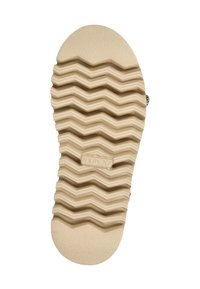 Sola di scarpa beige con un profondo motivo a zigzag e il nome del marchio "Replay" impresso al centro.