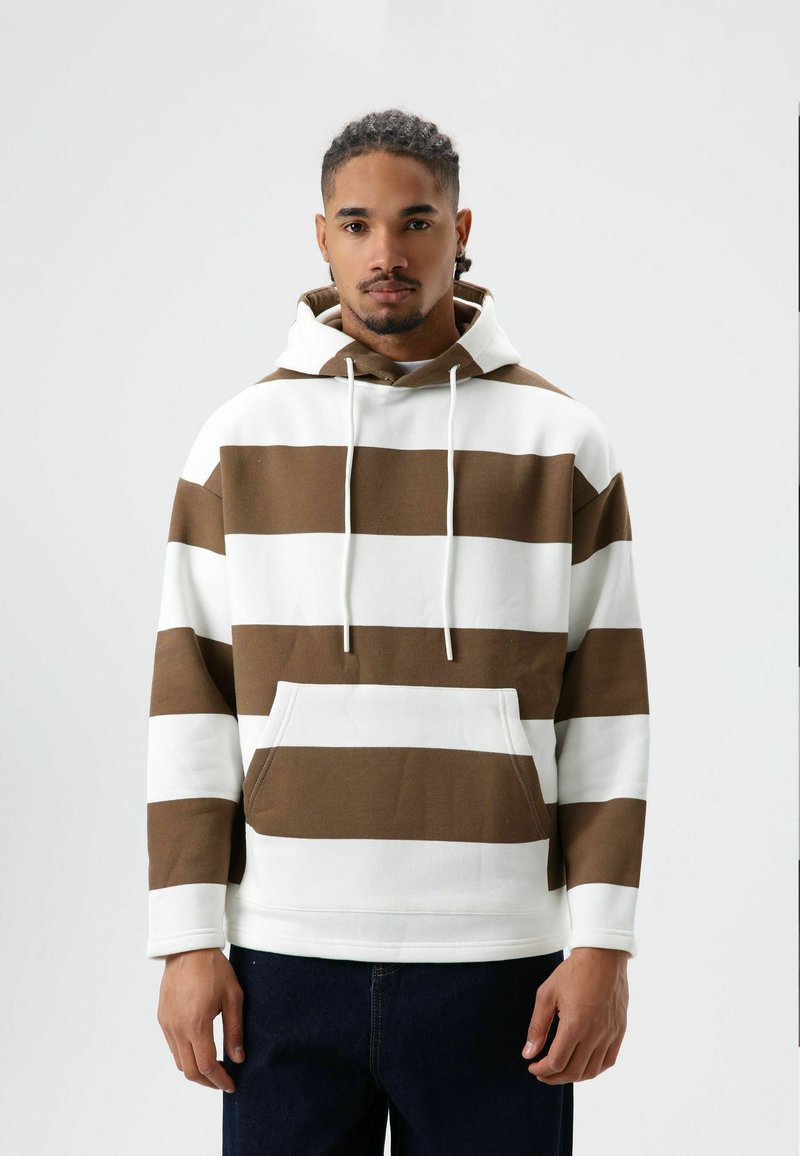 Bruin-wit gestreepte hoodie met een zak aan de voorkant, capuchon met trekkoord en geribbelde boorden. Gemaakt van zachte stof, met een ontspannen pasvorm.