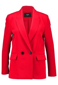 Červený dvouřadový blazer vyrobený z hladkého materiálu; má vykrojené klopy, dvě přední kapsy a černé knoflíky.