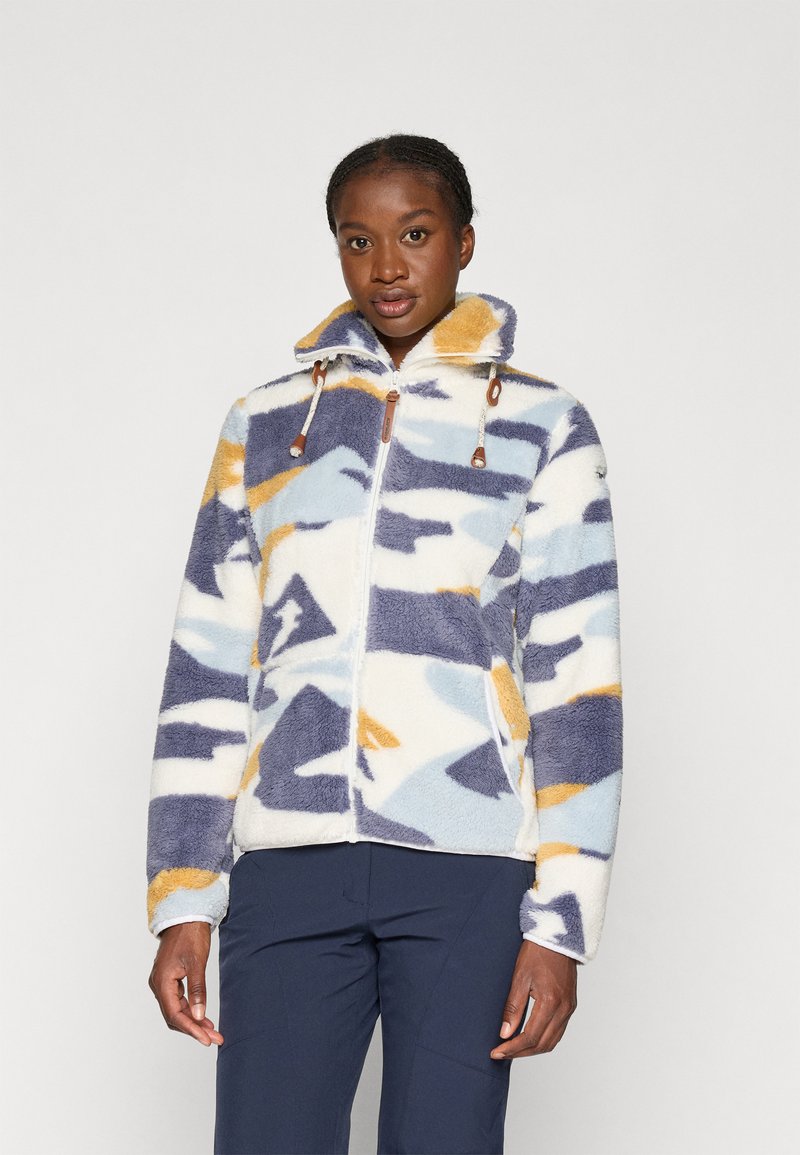 Fleecjack met een mix van blauwe, gele en witte abstracte patronen, hoge kraag en bruine hardware accenten. Voorzien van een ritssluitingen.