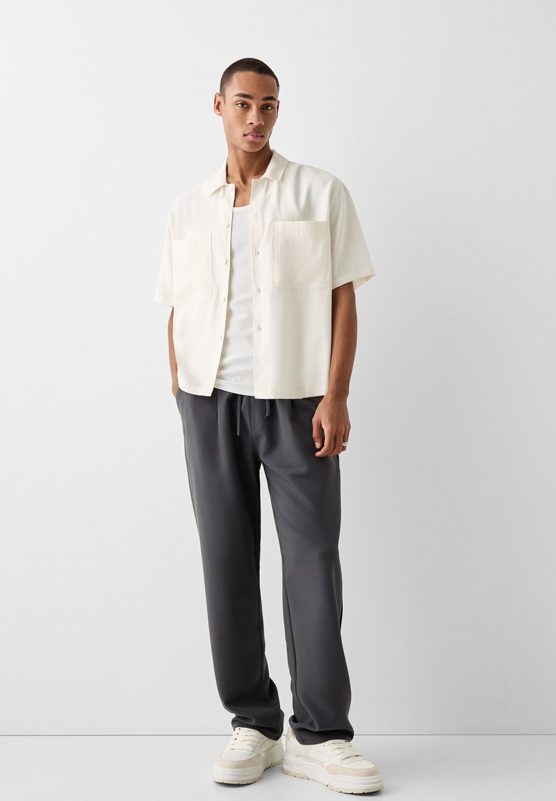 Bershka Trainingsbroek donkergrijs Bershka Trainingsbroek donkergrijs