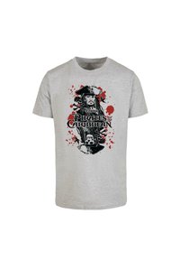 Gray cotton T-shirt featuring a black and red graphic of a pirate with the text "Disney Pirates of the Caribbean" and splatter accents.