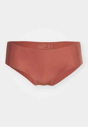 Mid-rise brief in terracotta kleur, gemaakt van gladde, rekbare stof. Naadloze zijkanten met een minimalistisch ontwerp en geen zichtbare branding.