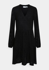 Robe noire à manches longues avec col en V, motif texturé et détails œillets, avec une taille froncée et une jupe à volants.