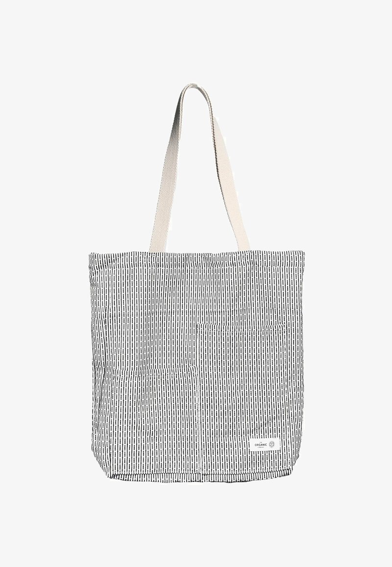 Juoda ir balta dryžuota audinio rankinė su stačiakampio formos priekiu, turinti priekinę kišenę ir kreminės spalvos rankenas.