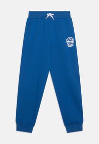 Blauwe katoenen sweatpants met een geribbelde tailleband, een trekkoord en boorden. Bevat een wit Timberland-logo op de linkerdij.
