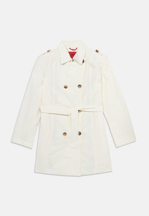 White double-breasted trench coat with belted waist and shoulder epaulets, laid flat on a neutral background.