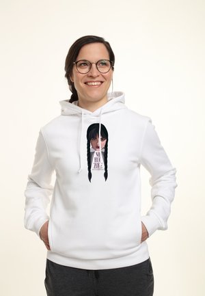 White hoodie featuring a graphic print of a girl with black braids and the text "NO HUG ZONE." Soft fabric, adjustable drawstring hood, front pockets.