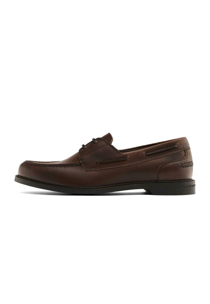 Brown leather men's loafer with moc toe stitching, slip-on design, and black rubber sole on a white background.