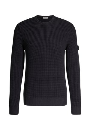 Maglione nero a coste con maniche lunghe e scollo rotondo, polsini e orlo a coste, con una piccola etichetta in tessuto sul braccio superiore.