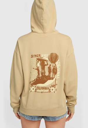 Bruine grafische hoodie in lichtbeige, met een vintage ontwerp op de achterkant met surf- en heteluchtballonmotieven, en een losse pasvorm.