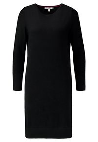 Robe noire en maille avec un décolleté rond et des manches longues. Elle présente une silhouette ajustée, des poignets côtelés et un ourlet droit.