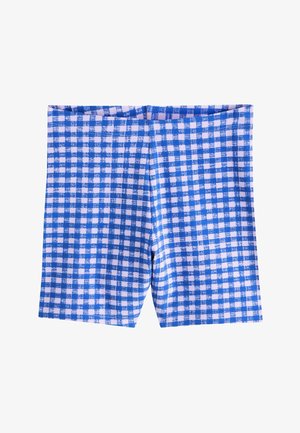 Pantaloncini a quadretti blu e bianchi con un motivo leggermente testurizzato, mostrati distesi su uno sfondo bianco.