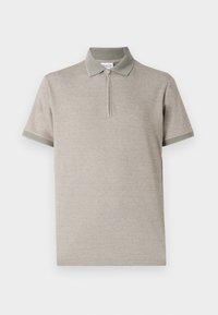 Polo à manches courtes en coton beige clair avec un col zippé et des accents verts contrastants au col et aux ourlets des manches. Texture lisse.