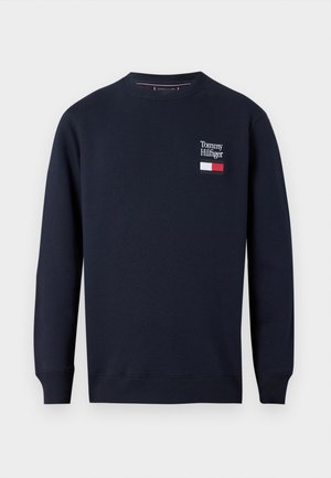 Felpa blu navy realizzata in misto cotone, con scollatura rotonda, maniche lunghe e logo ricamato con dettagli della bandiera sul petto.